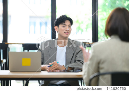 Young Asian Male Manager Conducting Job Interview with Candidate in Modern Office 141020760