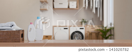 3D Illustrations of Modern Laundry Room with Detergent Bottles, Wicker Basket, and Washing Machine Interior 3D Illustrations of Modern Laundry Room with Detergent Bottles, Wicker Basket, and Washing Machine Interior 141020782