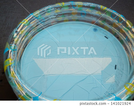 A plastic pool filled with water A plastic pool filled with water 141021924