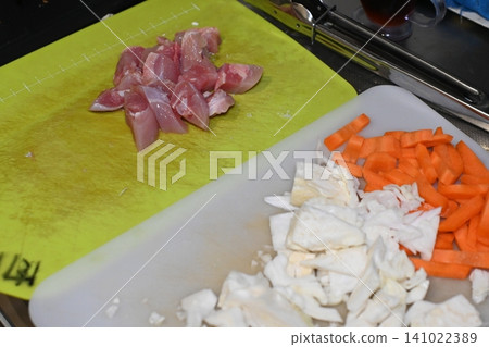 Pre-cut fresh chicken and colorful vegetables 141022389
