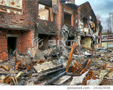 Building destruction in a city area after a major disaster event with debris scattered everywhere Building destruction in a city area after a major disaster event with debris scattered everywhere 141023036