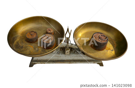 A vintage kitchen scale with two brass pans is shown. The scale has four rusty iron weights placed on one side. This item reflects cooking tools from past times and can relate to concepts of balance. A vintage kitchen scale with two brass pans is shown. The scale has four rusty iron weights placed on one side. This item reflects cooking tools from past times and can relate to concepts of balance. 141023098