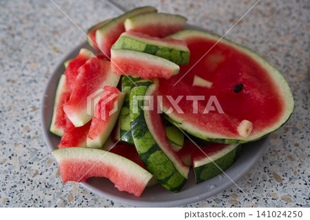 Sliced watermelon on a plate 141024250
