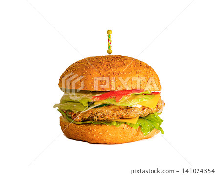 A delicious homemade cheeseburger with fresh lettuce and tomato on a sesame seed bun, garnished with a skewer A delicious homemade cheeseburger with fresh lettuce and tomato on a sesame seed bun, garnished with a skewer 141024354