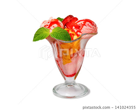 A colorful ice cream dessert in a glass dish with fresh strawberries and mint A colorful ice cream dessert in a glass dish with fresh strawberries and mint 141024355