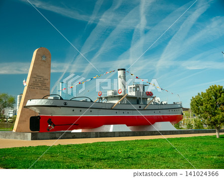 Volgograd river embankment with historic ship monument and memorial stele, Russia 141024366
