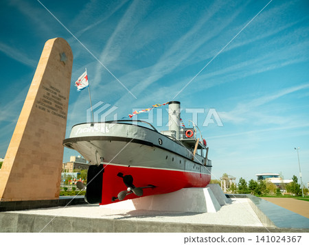 Volgograd river embankment with historic ship monument and memorial stele, Russia 141024367
