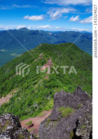 A magnificent panoramic view of Mount Nikko-Shirane from the western end of Mount Nantai. A magnificent panoramic view of Mount Nikko-Shirane from the western end of Mount Nantai. 141024627
