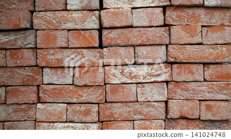 Full frame texture of stacked rustic red clay bricks Full frame texture of stacked rustic red clay bricks 141024748
