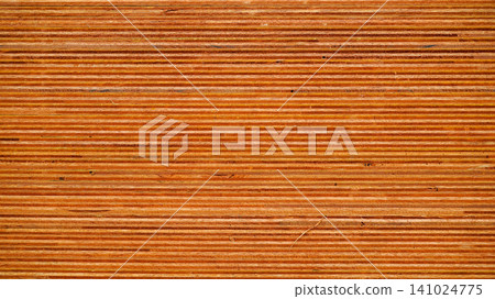 Side view profile of stacked plywood sheets showing linear layers Side view profile of stacked plywood sheets showing linear layers 141024775