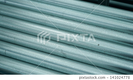 Stack of galvanized steel pipes close up 141024778