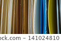 Vertical samples of wooden veneers and colorful plastic sheets 141024810