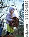 Young father, pre-teen daughter and son in warm autumn clothes spending quality time together among fallen leaves. Happy family enjoying the beauty of fall, playful moments and family life outdoors 141024889