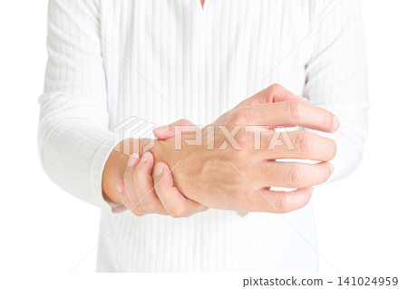 The man touches the wrist and thumb. He squeezes the knuckle of the thumb and wrist. He suffered a tendon injury, arthritis in his wrist, and de quervain's disease. The man touches the wrist and thumb. He squeezes the knuckle of the thumb and wrist. He suffered a tendon injury, arthritis in his wrist, and de quervain's disease. 141024959