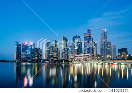 Singapore Central Business District seen from Marina bay transform from dawn to morning. Singapore Central Business District seen from Marina bay transform from dawn to morning. 141025371