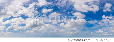 Wide angle panorama of beautiful sky with cumulus clouds over a clear horizon. Wide angle panorama of beautiful sky with cumulus clouds over a clear horizon. 141025372