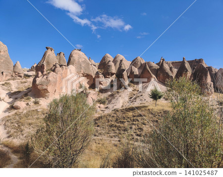 Unique fairy chimney rock formations and conical peaks in Cappadocia Turkey Unique fairy chimney rock formations and conical peaks in Cappadocia Turkey 141025487