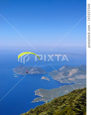 beautiful landscape with a view of the sea flying on a paraglider 141025508