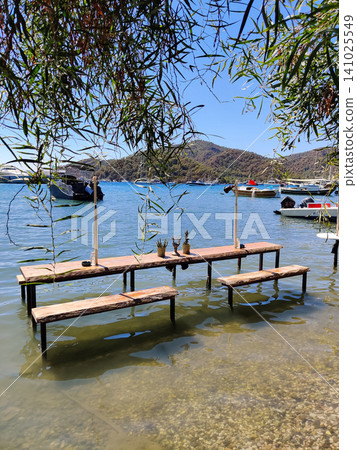 beautiful ships and boats are moored near the shore beautiful ships and boats are moored near the shore 141025549