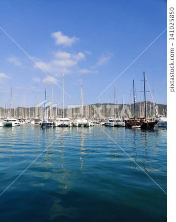beautiful ships and boats are moored near the shore beautiful ships and boats are moored near the shore 141025850