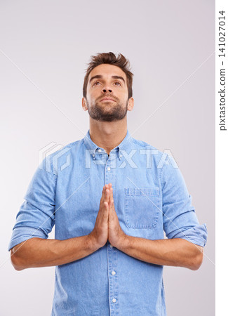 Man, praying and worship with praise for God, seek help and advice for guidance with hands together on white background. Spiritual, faith and gratitude with thanks, religion and forgiveness with hope Man, praying and worship with praise for God, seek help and advice for guidance with hands together on white background. Spiritual, faith and gratitude with thanks, religion and forgiveness with hope 141027014