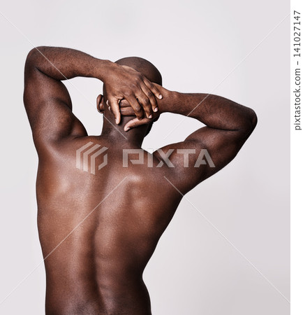 Back, stretching and man in studio with health, wellness and fitness or exercise on a white background. Bodybuilder, person or model with art deco or muscle, workout and warm up for sports training Back, stretching and man in studio with health, wellness and fitness or exercise on a white background. Bodybuilder, person or model with art deco or muscle, workout and warm up for sports training 141027147
