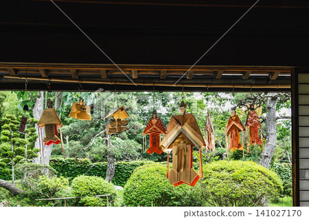 Colorful Tanabata dolls hanging on the veranda of an old house Colorful Tanabata dolls hanging on the veranda of an old house 141027170