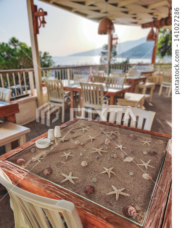 Sunset terrace in Kalkan with unique sand and starfish table decor Sunset terrace in Kalkan with unique sand and starfish table decor 141027286