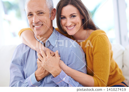 Happy, couple and hug in portrait, love with unique relationship and support for trust at home. Aged man, young woman and age difference in marriage, commitment and loyalty with pride together Happy, couple and hug in portrait, love with unique relationship and support for trust at home. Aged man, young woman and age difference in marriage, commitment and loyalty with pride together 141027419