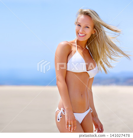 Excited, beach and portrait of woman in bikini on vacation, adventure or holiday for travel. Smile, happy and female person in swimwear on tropical weekend trip by ocean in Australia for summer. Excited, beach and portrait of woman in bikini on vacation, adventure or holiday for travel. Smile, happy and female person in swimwear on tropical weekend trip by ocean in Australia for summer. 141027478