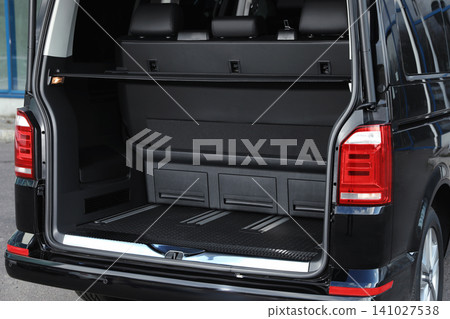 Modern car with open empty trunk outdoors 141027538