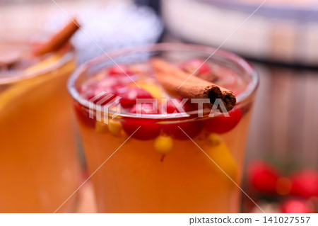 Tasty aromatic mulled wine on blurred background, closeup 141027557