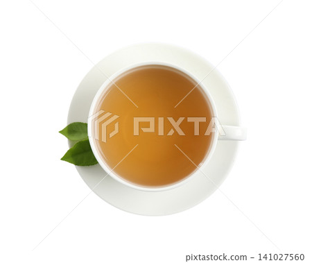 Cup of green tea and leaves isolated on white, top view Cup of green tea and leaves isolated on white, top view 141027560