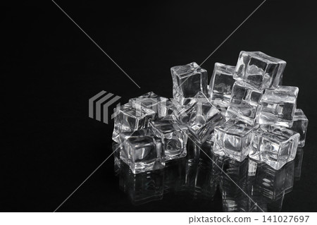 Crystal clear ice cubes on black background Crystal clear ice cubes on black background 141027697