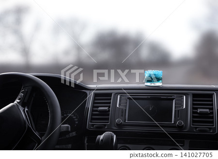 Stylish air freshener on dashboard in car 141027705