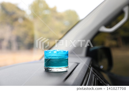 Stylish air freshener on dashboard in car. Space for text 141027708