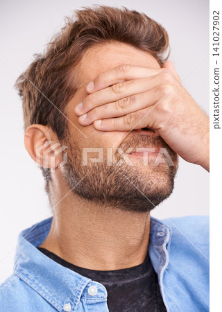 Man, face palm and mistake with thinking, regret or anxiety on a grey studio background. Person, fail or model with stress or memory with embarrassing with shame or bad decision with emoji or choice Man, face palm and mistake with thinking, regret or anxiety on a grey studio background. Person, fail or model with stress or memory with embarrassing with shame or bad decision with emoji or choice 141027902