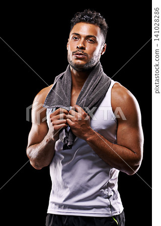 Fitness, face and man in studio with towel, confidence and workout routine break in health, wellness and power. Relax, pride and strong athlete on black background for exercise, results and muscle 141028286