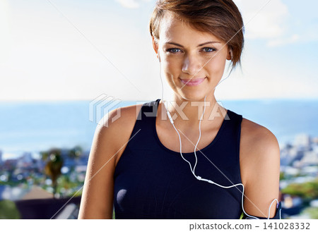 Outdoor, portrait or woman in earphones for fitness workout, exercise or healthy wellness in nature. Sky, listen or happy female sports person ready to start training with confidence, music or smile 141028332
