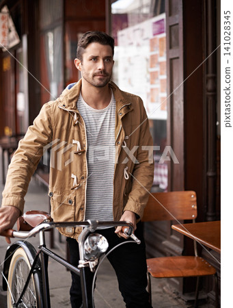 Sidewalk, cafe and man with bicycle walking in city, thinking and eco friendly transport. Carbon neutral, sustainability and tourist on street for urban journey, morning travel and male with bike Sidewalk, cafe and man with bicycle walking in city, thinking and eco friendly transport. Carbon neutral, sustainability and tourist on street for urban journey, morning travel and male with bike 141028345