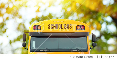 Yellow school bus outdoors, closeup. Transport for students Yellow school bus outdoors, closeup. Transport for students 141028377