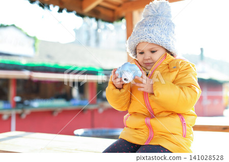 Cute little photographer with toy camera outdoors 141028528