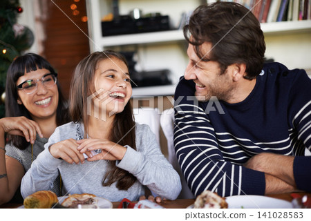 Christmas, family and parents laugh with child in home for dinner, lunch and eating together. happy mother, father and girl with food for holiday, vacation and festive celebration at dining table Christmas, family and parents laugh with child in home for dinner, lunch and eating together. happy mother, father and girl with food for holiday, vacation and festive celebration at dining table 141028583