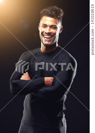 Fitness, portrait and man in studio with smile, confidence and workout routine in health, wellness and power. Arms crossed, pride and strong athlete on black background for exercise, results and care Fitness, portrait and man in studio with smile, confidence and workout routine in health, wellness and power. Arms crossed, pride and strong athlete on black background for exercise, results and care 141028619