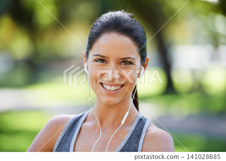 Park, fitness and portrait of woman with earphones for exercise, training and cardio music. Athlete person, smile and headphones with happiness for audio streaming, podcast and healthy body workout Park, fitness and portrait of woman with earphones for exercise, training and cardio music. Athlete person, smile and headphones with happiness for audio streaming, podcast and healthy body workout 141028685