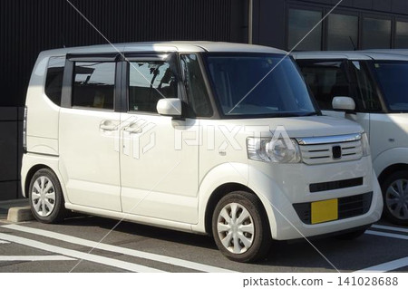 A light vehicle parked in a parking lot A light vehicle parked in a parking lot 141028688