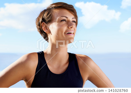 Woman, happy and wellness with blue sky for fitness, training or thinking of exercise in nature. Athlete, active person and face with smile outdoor in summer with sportswear for workout session Woman, happy and wellness with blue sky for fitness, training or thinking of exercise in nature. Athlete, active person and face with smile outdoor in summer with sportswear for workout session 141028760