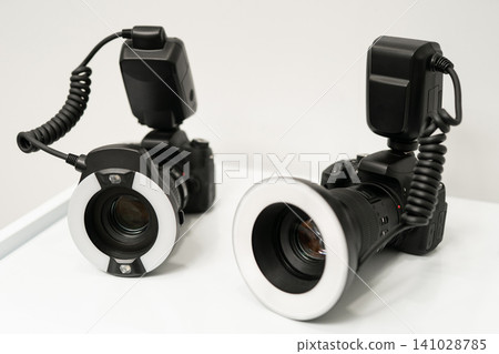 Two professional DSLR cameras with ring flashes for dental photography Two professional DSLR cameras with ring flashes for dental photography 141028785