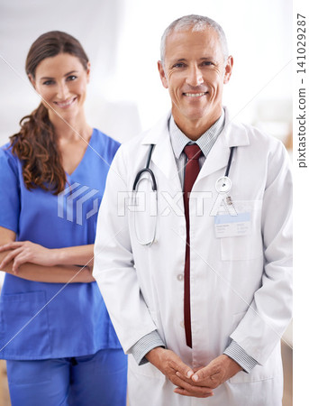 Doctor, man and nurse in portrait with smile for medical support, wellness and arms crossed in hospital. Medic, surgeon and woman in team, happy and health services in clinic with pride for career Doctor, man and nurse in portrait with smile for medical support, wellness and arms crossed in hospital. Medic, surgeon and woman in team, happy and health services in clinic with pride for career 141029287