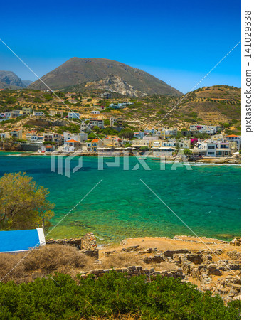 The Moklos archaeological site on Crete, Greece, and a view of the village of Moklos across the shallow waters. The Moklos archaeological site on Crete, Greece, and a view of the village of Moklos across the shallow waters. 141029338
